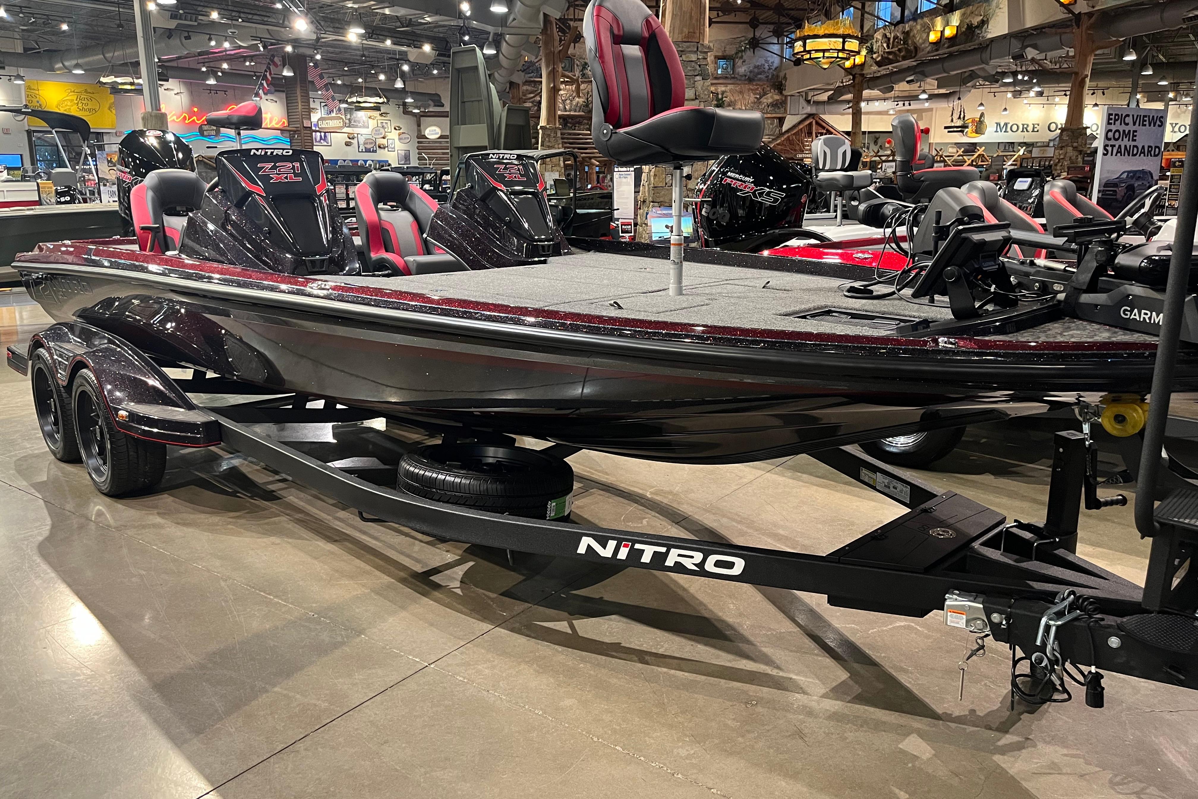 Nitro Z21 XL Pro 2026 Nitro Z21 XL Pro bass boat displayed in a showroom with sleek design and modern features.