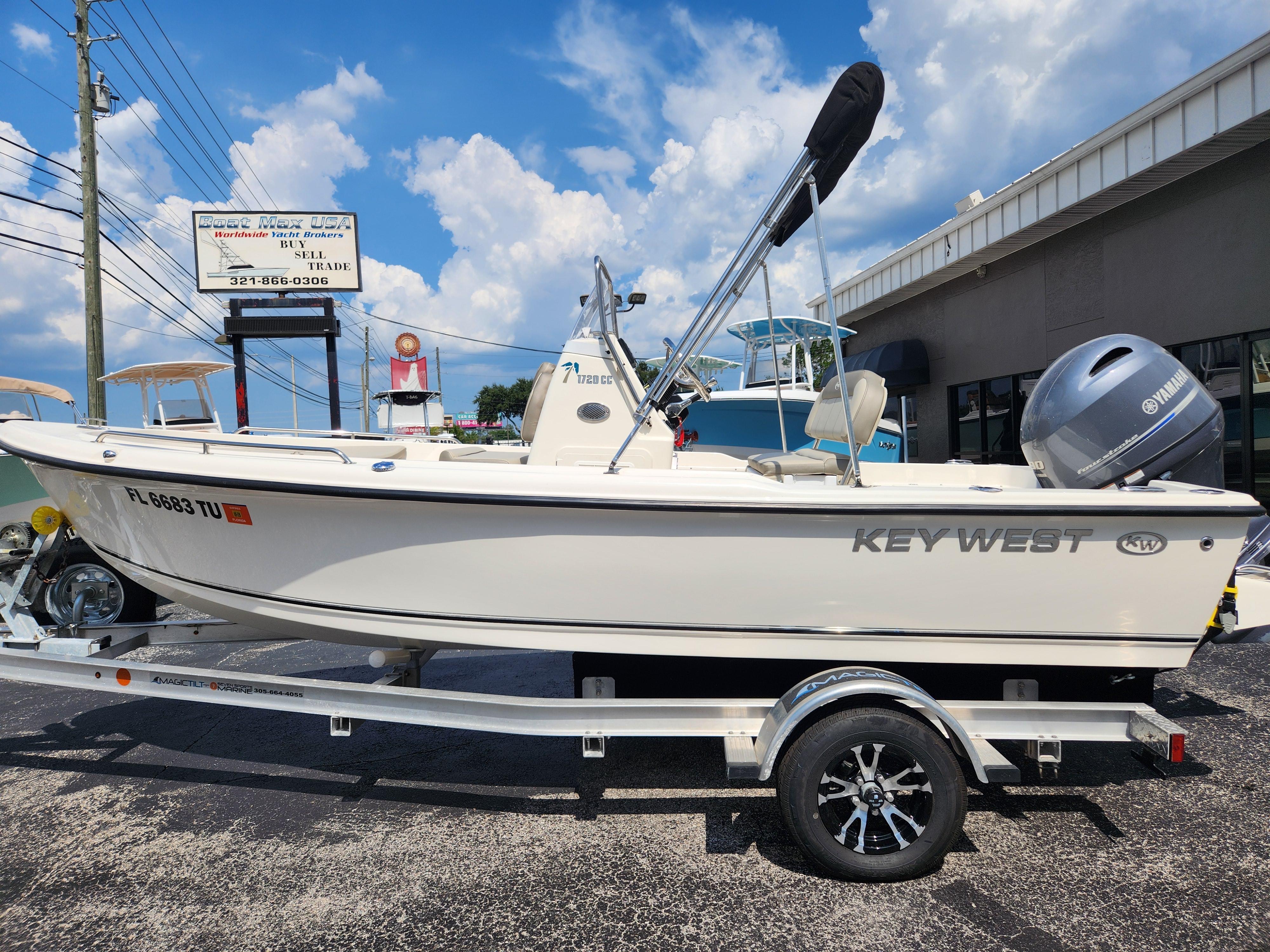 Key West 1720 CC 2024 Key West 1720 CC boat on trailer, displayed outdoors under a blue sky.
