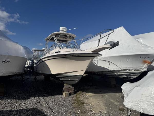 Grady-White Journey 258 2007 Grady-White 258 Journey boat stored outdoors, surrounded by covered boats.