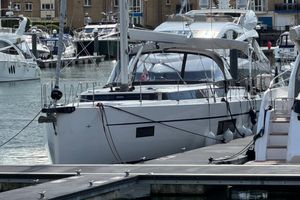 Bavaria C57 Style 2022 Bavaria C57 yacht docked in a marina, surrounded by other boats.