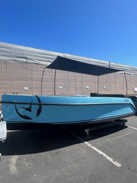 Vision Marine Technologies Volt 180 2023 Vision Marine Technologies Volt 180 boat in a parking lot, side view.