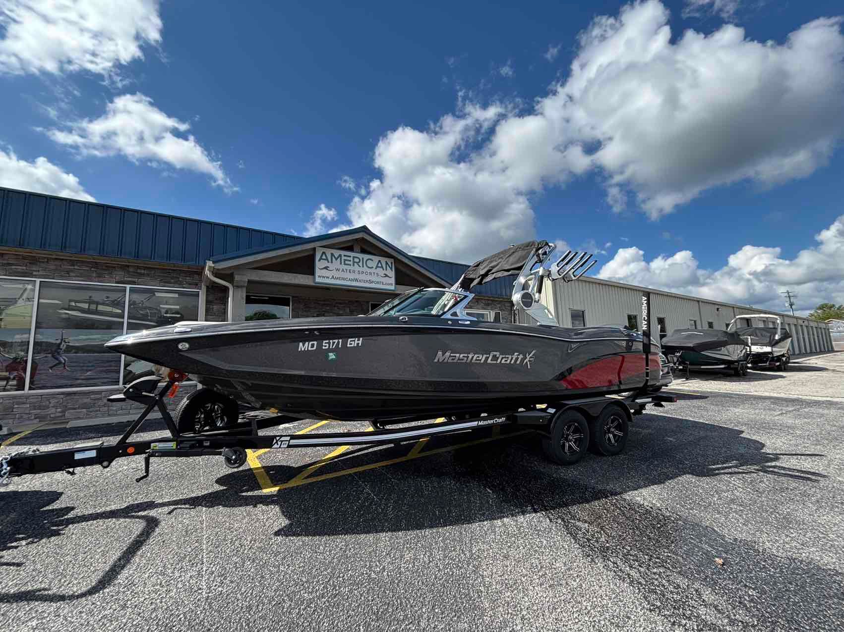 MasterCraft X46 2018 MasterCraft X46 boat on trailer at American Water Sports dealership.