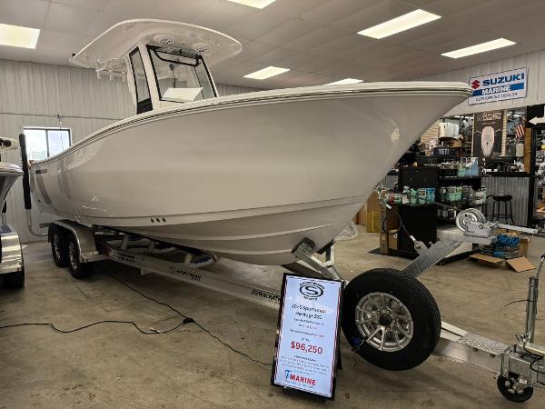 Sportsman Heritage 231 Center Console 2025 Sportsman Heritage 231 Center Console boat displayed indoors on a trailer.