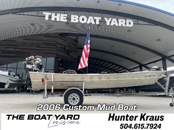 Custom 17 2006 Custom Mud Boat at The Boat Yard, Louisiana, with American flag and contact info.