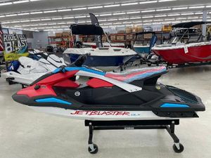 Yamaha WaveRunner JetBlaster DLX 3-Up 2025 Yamaha WaveRunner JetBlaster DLX 3-Up in showroom, vibrant red and blue design.