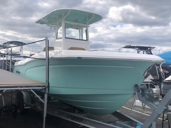 NauticStar 242L Offshore 2023 NauticStar 242L Offshore boat on trailer under cloudy sky.