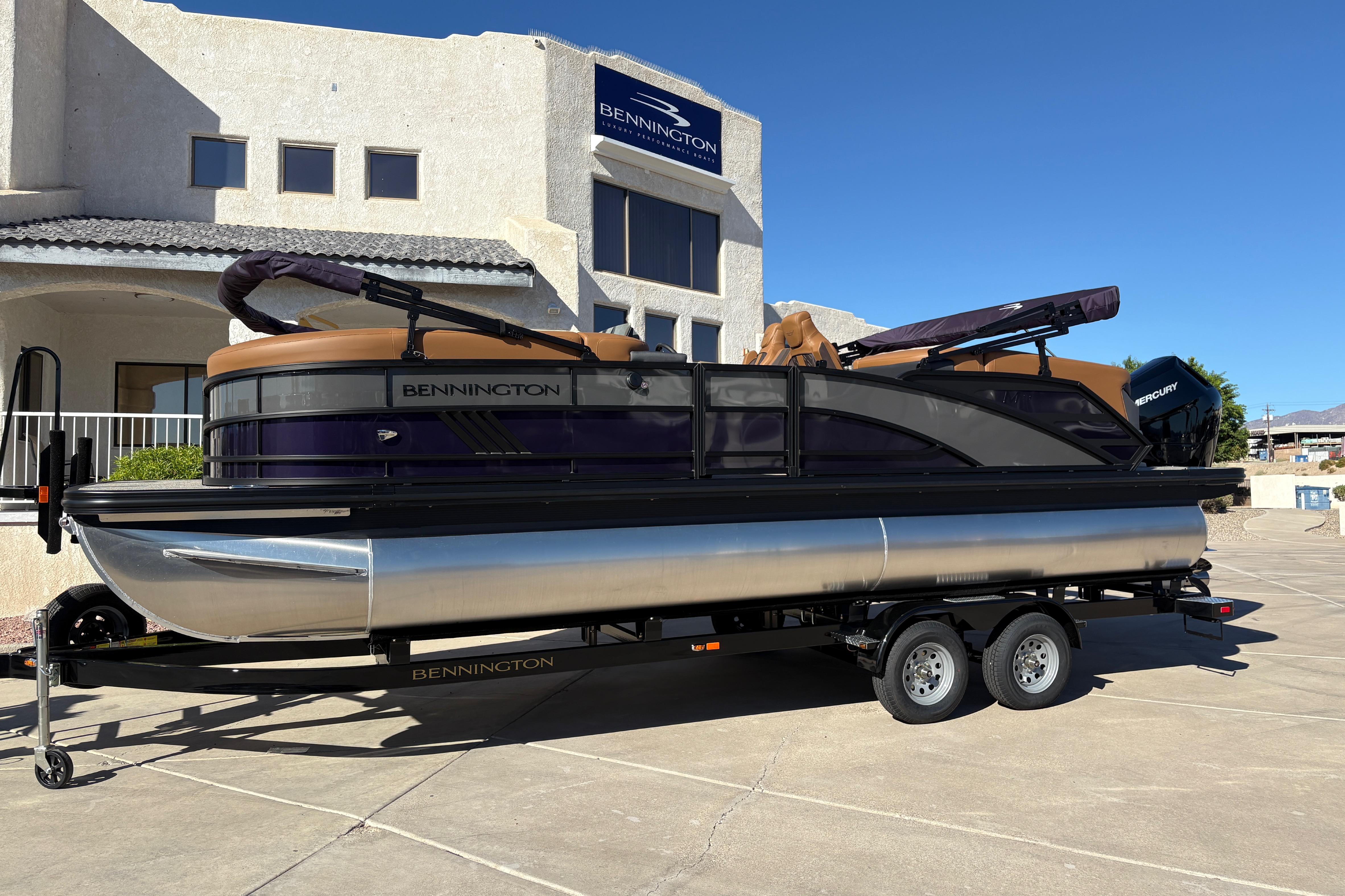 Bennington 24 MFB 2026 Bennington 24 MFB pontoon boat on trailer, parked outside dealership.