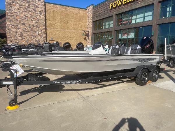 Ranger ALPHA 208 2025 Ranger ALPHA 208 boat on trailer outside a store.