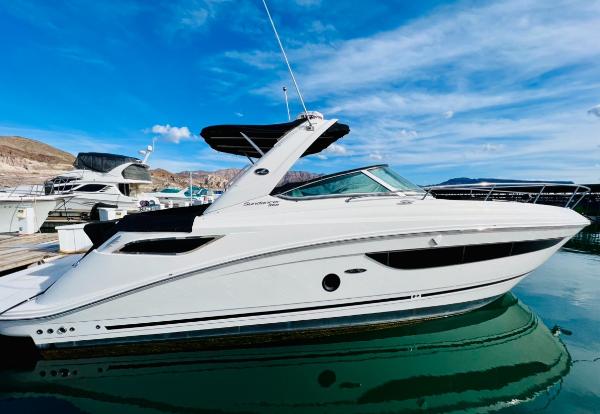 Sea Ray 350 Sundancer 2016 Sea Ray 350 Sundancer yacht docked on a sunny day.