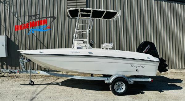 Bayliner Trophy T18 2025 Bayliner Trophy T18 boat on trailer, parked outdoors.