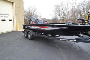 Tracker Savage 215 2025 Tracker Savage 215 boat parked near maintenance building.