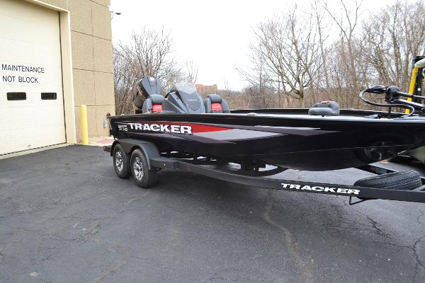 Tracker Savage 215 2025 Tracker Savage 215 boat parked near maintenance building.