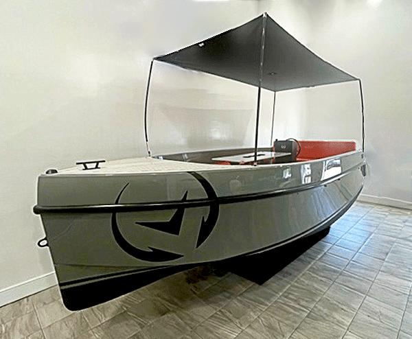 Vision Marine Technologies Volt 180 2024 Vision Marine Technologies Volt 180 boat with canopy, displayed indoors.