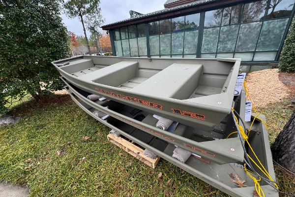 Tracker Grizzly 12 Jon 2025 Tracker Grizzly 12 Jon boat displayed outdoors near a building.