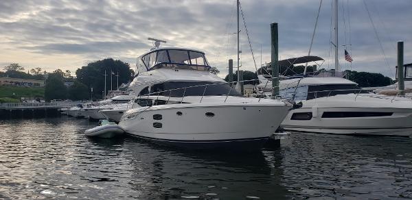 Meridian 441 Sedan 2010 Meridian 441 Sedan yacht docked in a marina under cloudy skies.