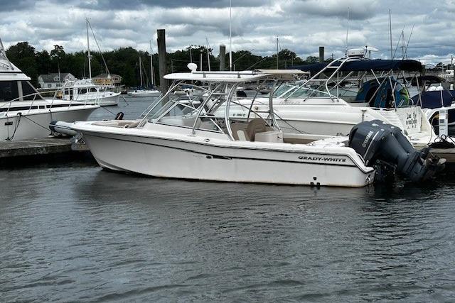 Grady-White Freedom 285 2013 Grady-White Freedom 285 boat docked in a marina, overcast sky.