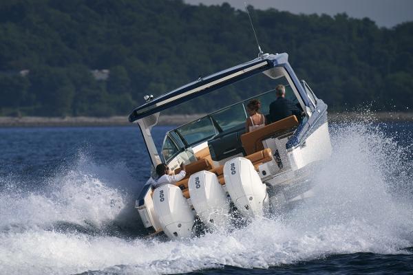 Aviara AV36 OB Manufacturer Provided Image: 2023 Aviara AV36 OB boat cruising on water with triple outboard engines.