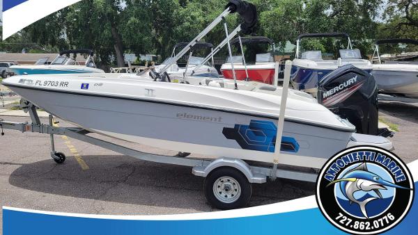 Bayliner Element E18 2019 Bayliner Element E18 boat on trailer at dealership, featuring Mercury outboard motor.