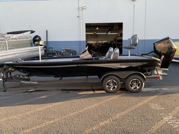 Ranger ALPHA 208 2025 Ranger ALPHA 208 boat on trailer outside a warehouse.