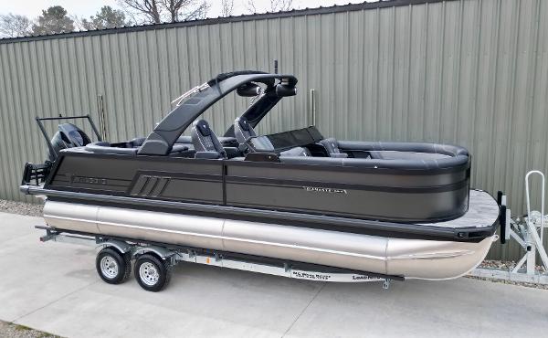 Viaggio Diamante UWA 2025 Viaggio Diamante UWA pontoon boat on trailer, sleek black design, parked outdoors.