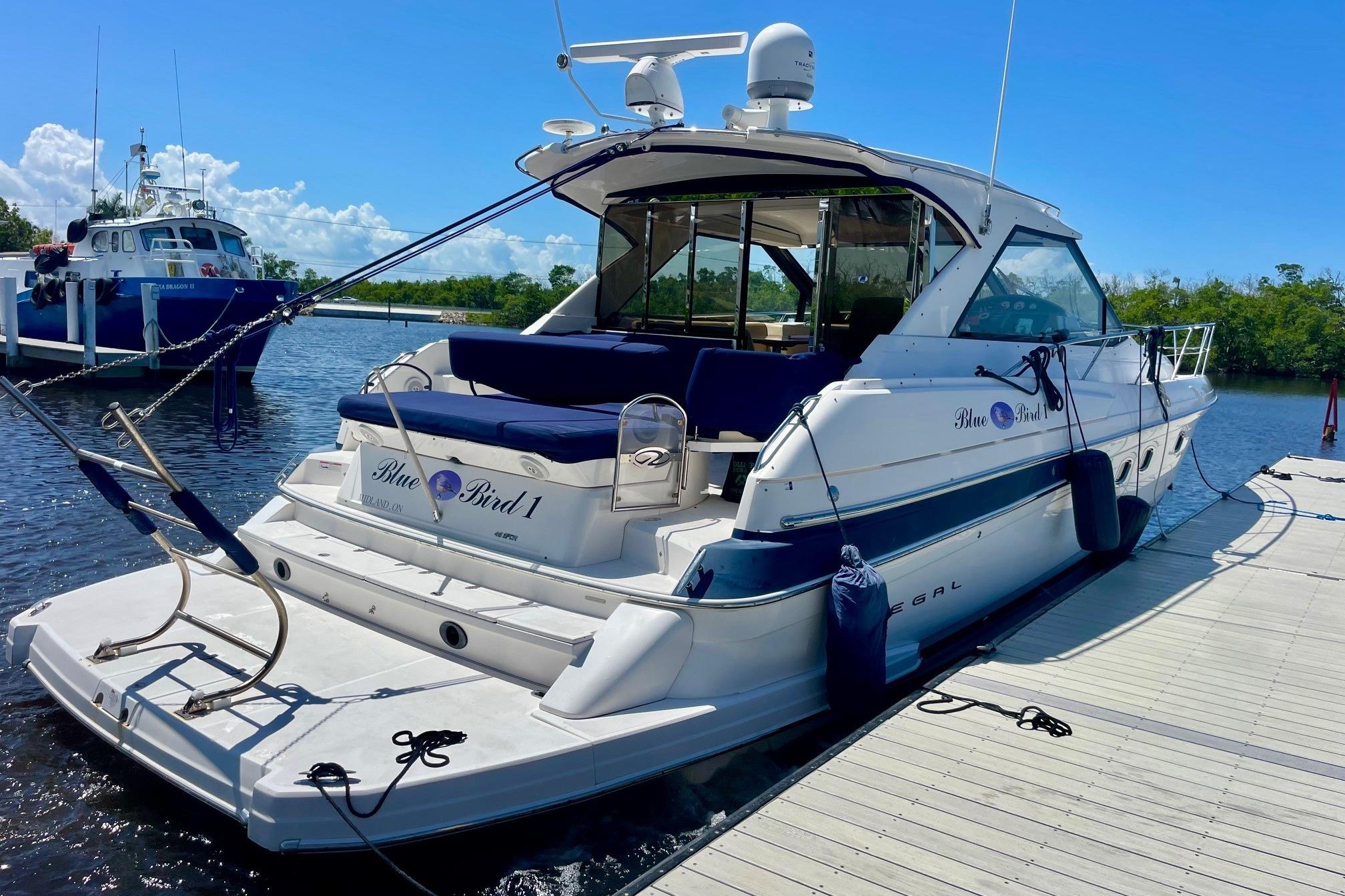 Regal 46 Sport Coupe 2011 Regal 46 Sport Coupe yacht docked on a sunny day.