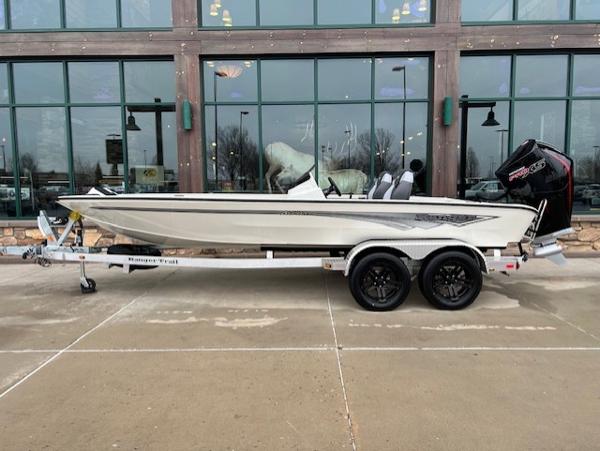 Ranger ALPHA 208 2025 Ranger ALPHA 208 boat on trailer, parked outside a building with large windows.
