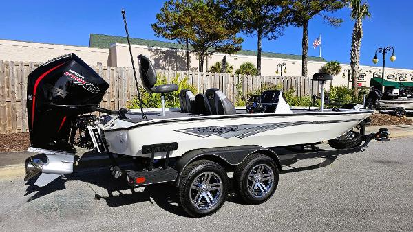 Ranger ALPHA 208 2025 Ranger ALPHA 208 boat with dual axle trailer, parked outdoors.