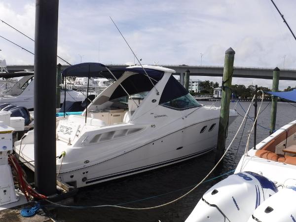 Sea Ray 310 Sundancer 2007 Sea Ray 310 boat docked at marina, featuring sleek design and spacious deck.