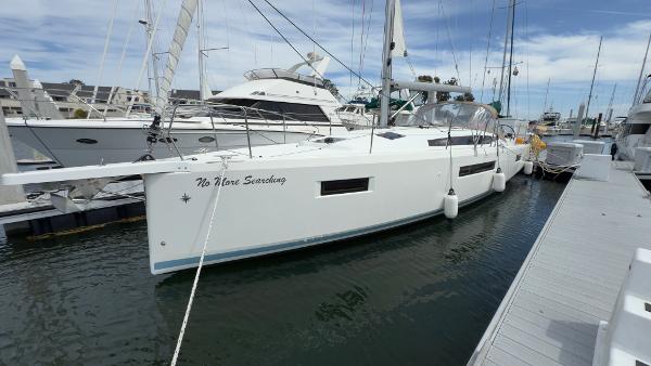 Jeanneau Sun Odyssey 410 2022 Jeanneau Sun Odyssey 410 sailboat docked at marina, side view.