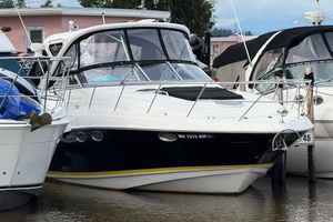 Regal Commodore 3760 IO 2007 Regal Commodore 3760 IO boat docked at marina, surrounded by other vessels.