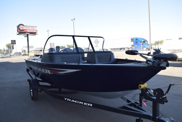 Tracker Pro Guide V-16 WT 2025 Tracker Pro Guide V-16 WT boat on trailer in parking lot.