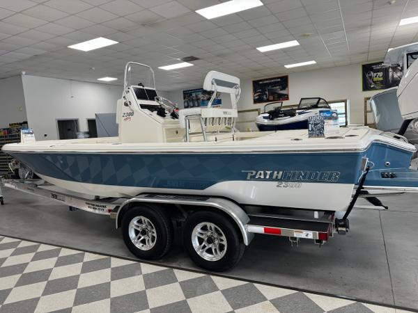 Pathfinder 2300 HPS 2025 Pathfinder 2300 HPS boat on trailer in showroom.
