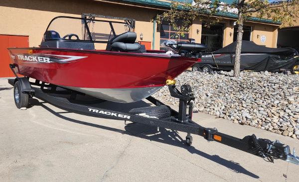 Tracker Pro Guide V-175 Combo 2025 Tracker Pro Guide V-175 Combo boat on trailer, red exterior, parked outdoors.