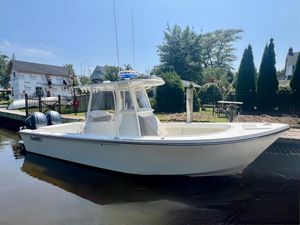 Parker 2801 Center Console 2023 Parker 2801 Center Console boat docked in a serene waterfront setting.