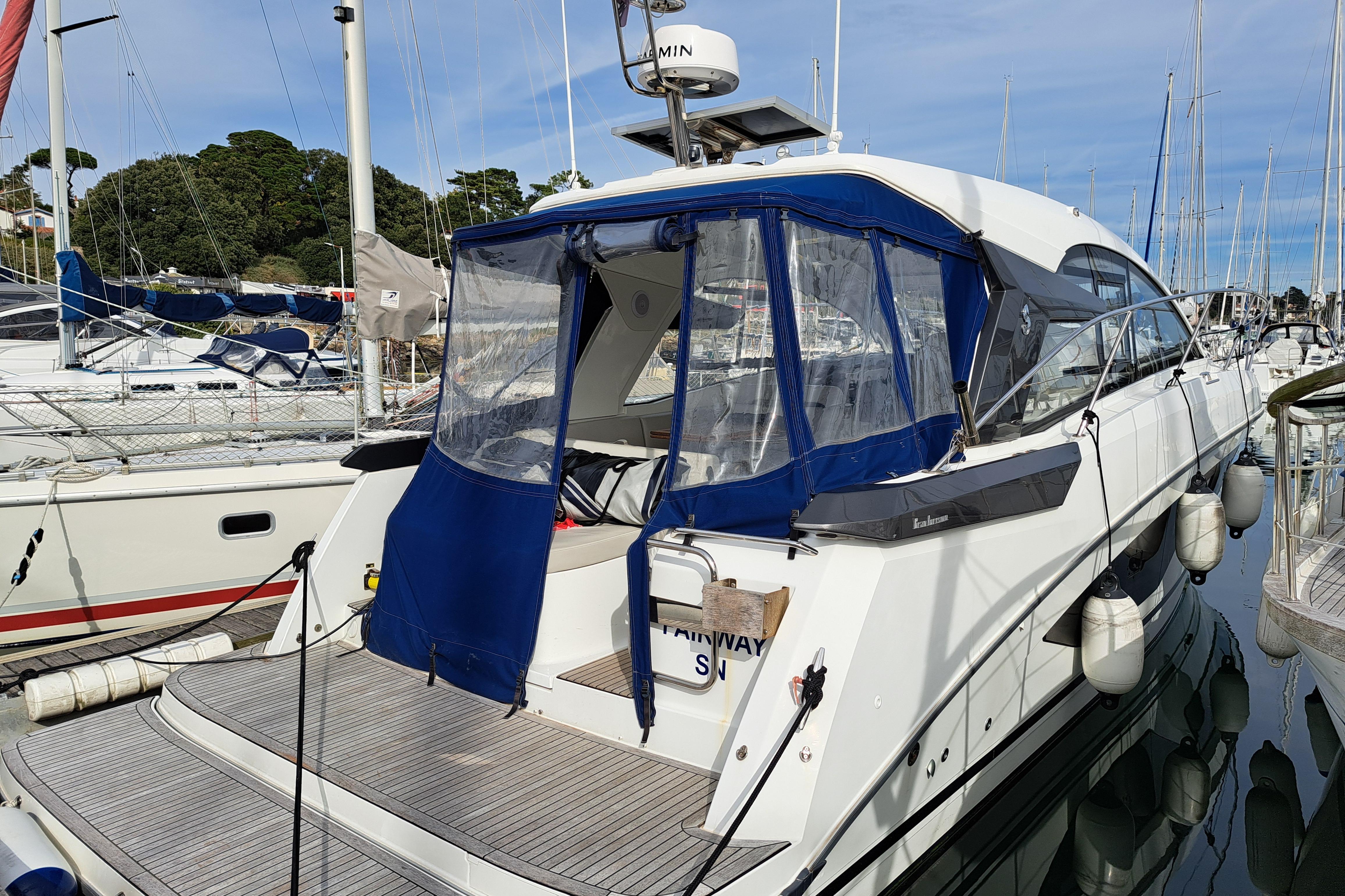 Beneteau Gran Turismo 36 2022 Beneteau Gran Turismo 36 yacht docked at marina with blue canopy.