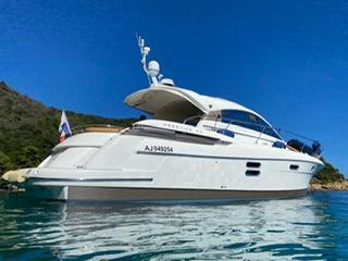 Jeanneau Prestige 50 S 2007 Jeanneau Prestige 50 S yacht on calm water under clear blue sky.
