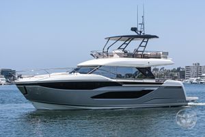 Prestige F4.9 2025 Prestige F4.9 yacht cruising on calm waters, showcasing sleek design and modern features.