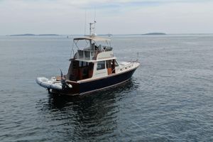 Lyman-Morse Custom Flybridge 1997 Lyman-Morse Custom Flybridge yacht on calm ocean waters.