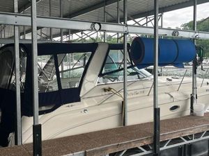 Rinker 310 Fiesta Vee 2000 Rinker 310 Fiesta Vee boat docked under a covered marina.
