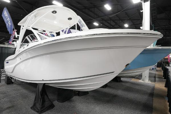 Sea Fox 228 Traveler 2025 Sea Fox 228 Traveler boat displayed indoors at a boat show.