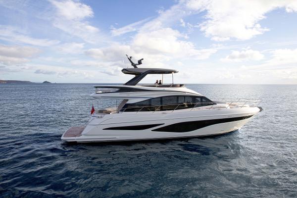 Princess F65 Luxury 2025 Princess F65 yacht cruising on open sea under a clear sky.