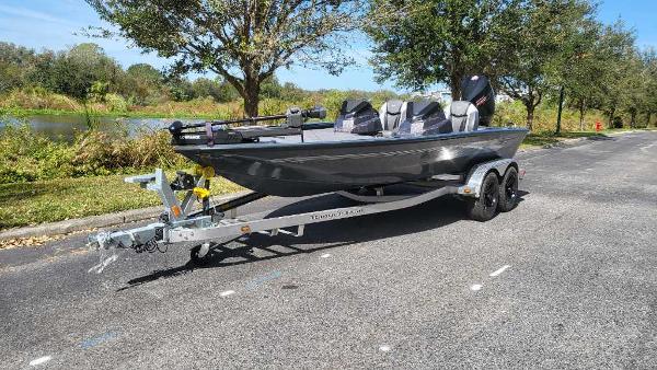 Ranger ALPHA 208 2025 Ranger ALPHA 208 boat on trailer, parked on a scenic road.