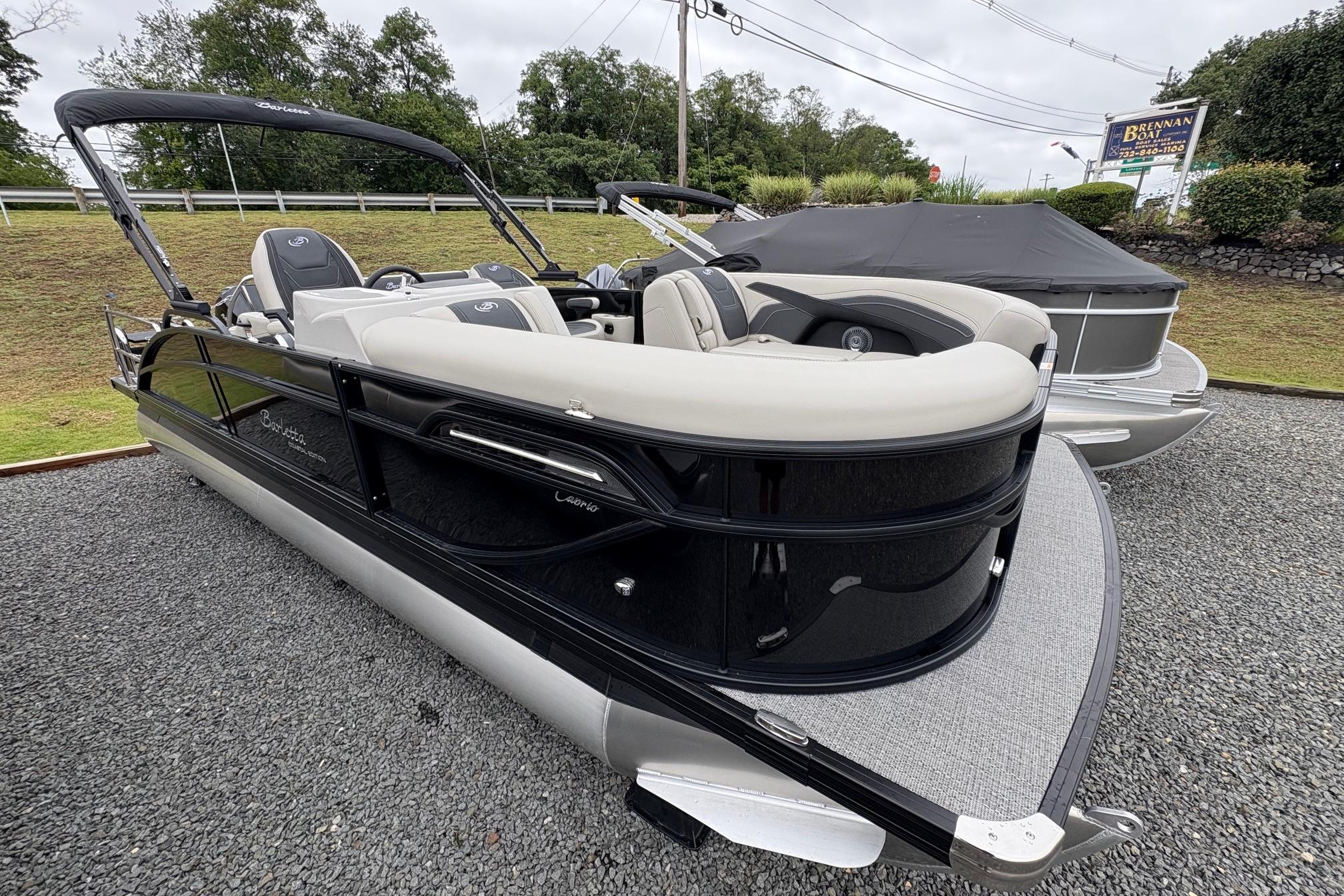Barletta C22UC 2026 Barletta C22UC pontoon boat with sleek design on display outdoors.