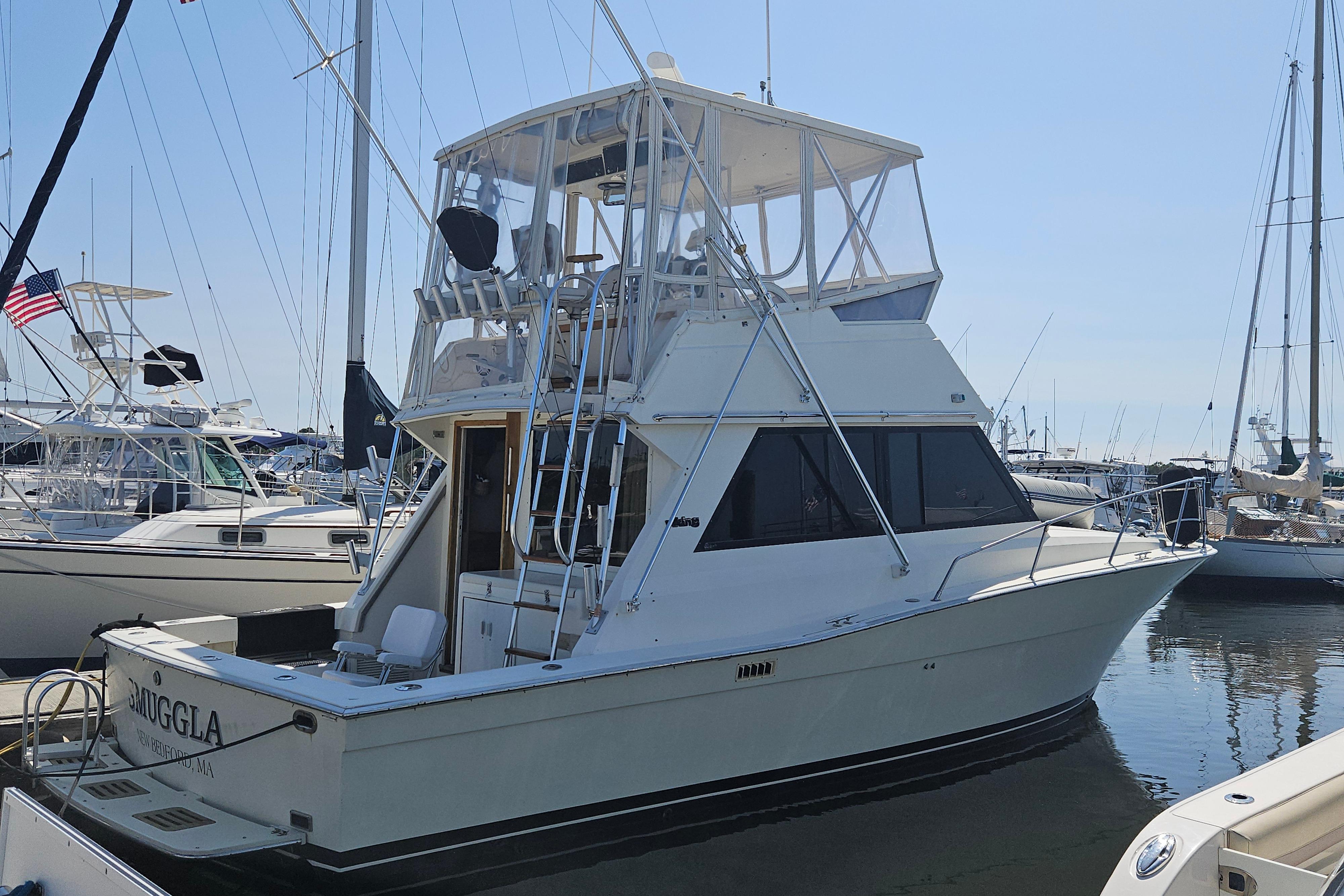 Viking 35 Convertible 1986 Viking 35 Convertible yacht docked in a marina, surrounded by other boats.
