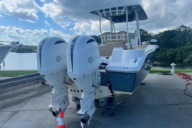 Key West 263 FS 2018 Key West 263 FS boat with dual outboard engines on a sunny day.