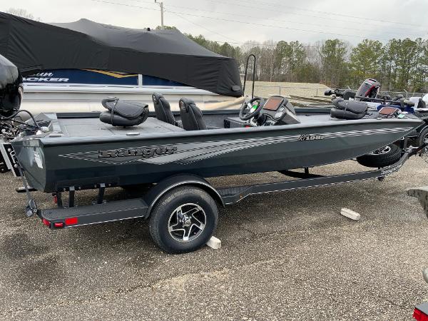Ranger RT198P 2025 Ranger RT198P fishing boat on trailer, sleek design, parked outdoors.