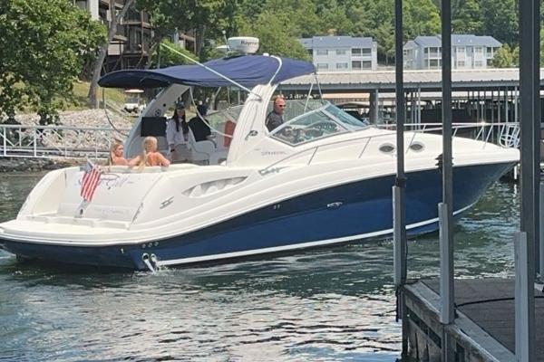 Sea Ray 340 Sundancer 2008 Sea Ray 340 Sundancer boat docked on a sunny day with passengers onboard.