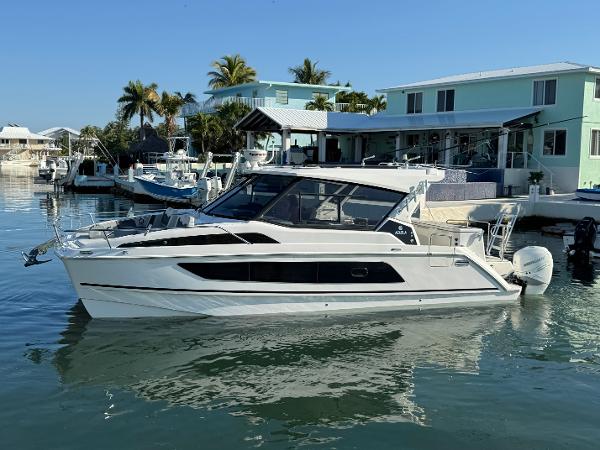 Aquila 36 Sport Aquila 36 Sport 2019 boat docked in a sunny waterfront setting.