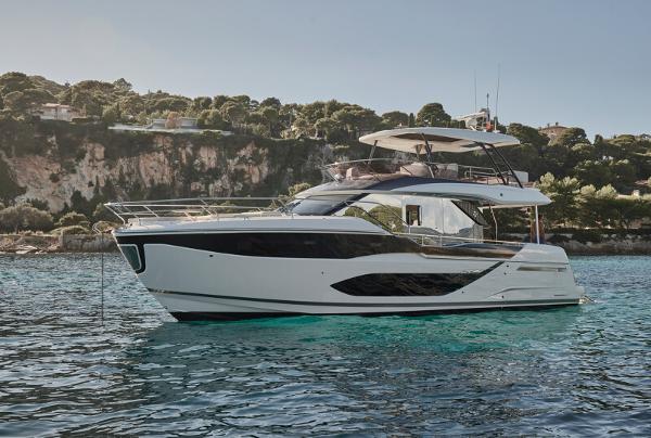 Prestige F5.7 Luxury Prestige F5.7 yacht cruising in scenic coastal waters, 2026 model.