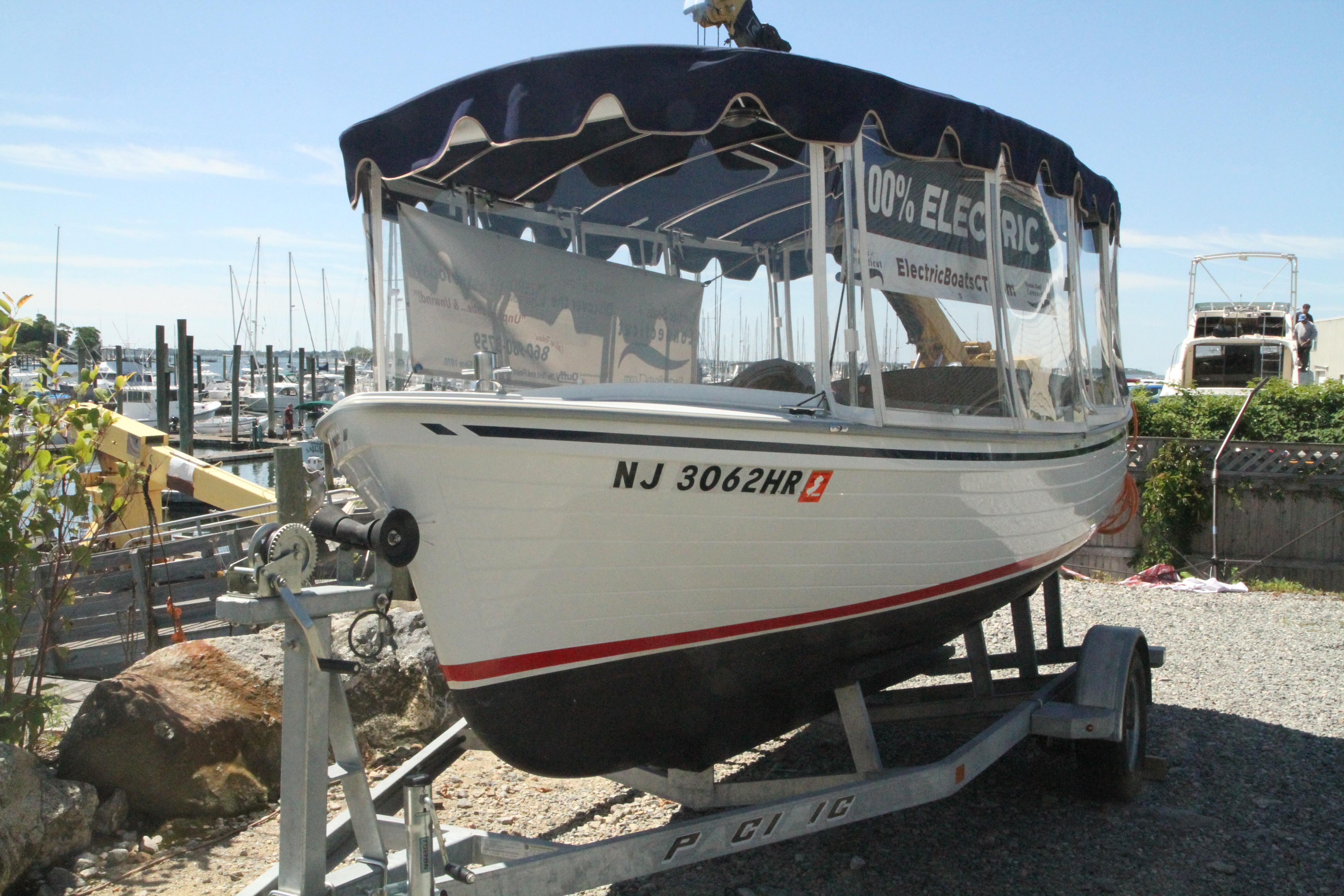 Duffy Back Bay 16 2022 Duffy Back Bay 16 electric boat on trailer at marina.